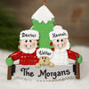 Personalized Christmas ornament with 'The Morgans' family on a couch in front of a tree.