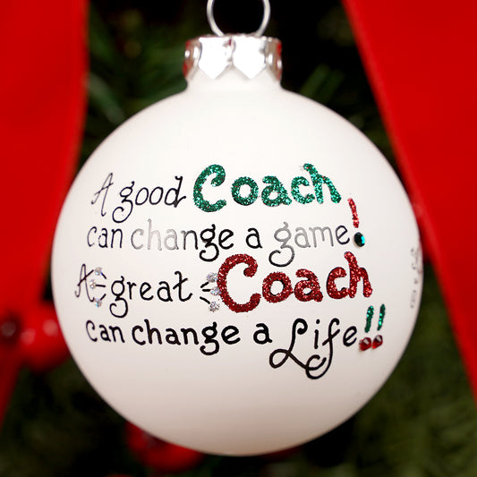 Decorative Christmas ornament with motivational quote on a tree.