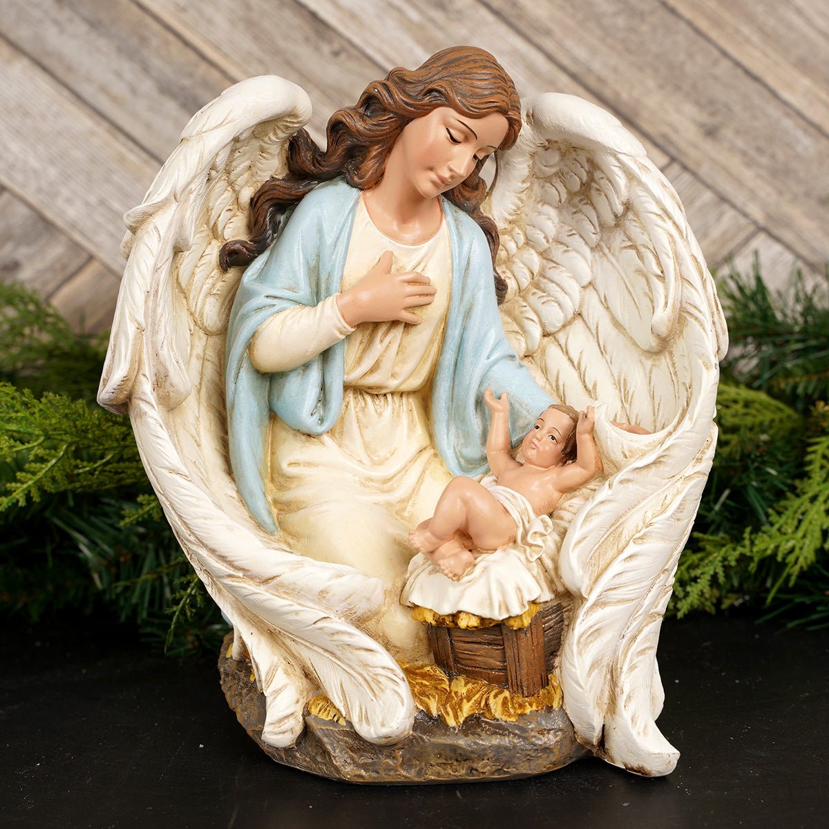 Angel With Baby Jesus - Christmas Place