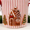 Decorative item with a gingerbread house and trees on a knitted background