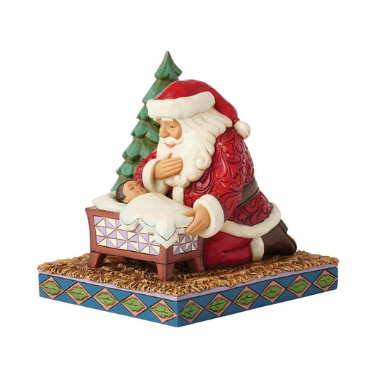 Santa Kneeling Over Baby Jesus