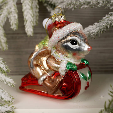 3.5IN GLASS CHIPMUNK RIDING SLEIGH ORN