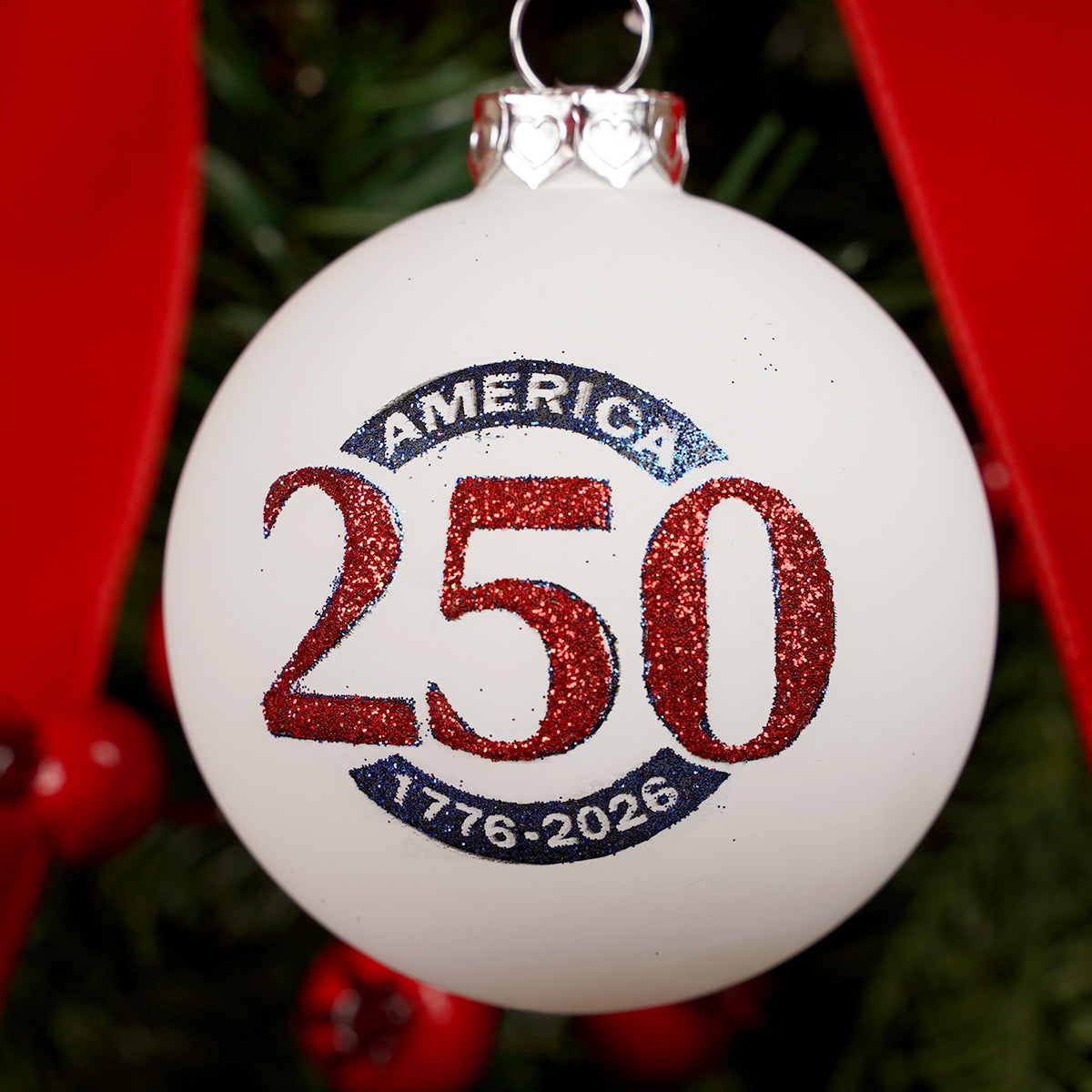 Decorative Christmas ornament with 'America 250' text on a white background