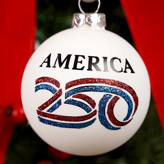 Christmas ornament with 'AMERICA' and number '250' design on a white background.