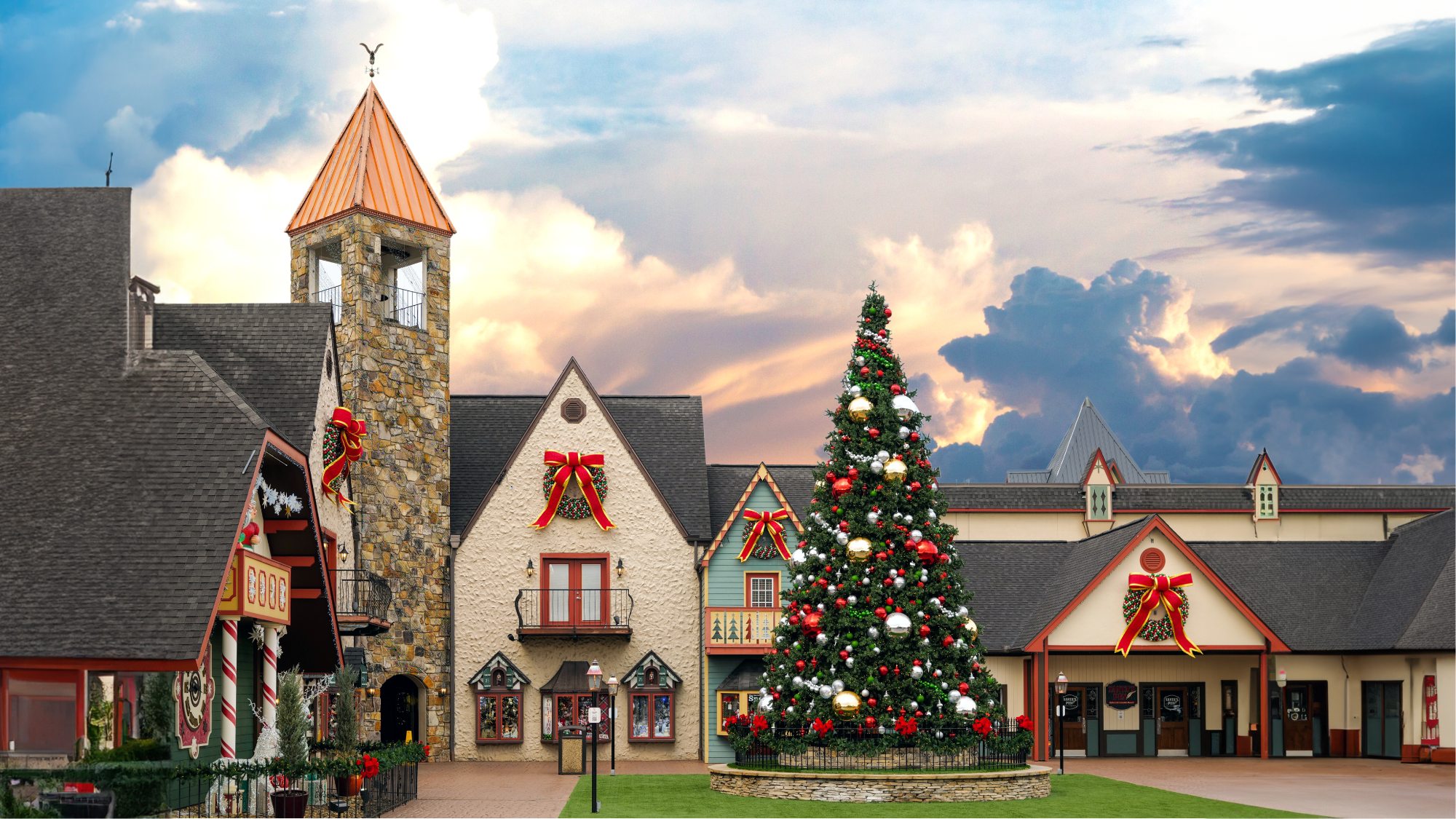 Christmas tree in front of Incredible Christmas Place Pigeon Forge TN with decorative ribbons against a cloudy sky.