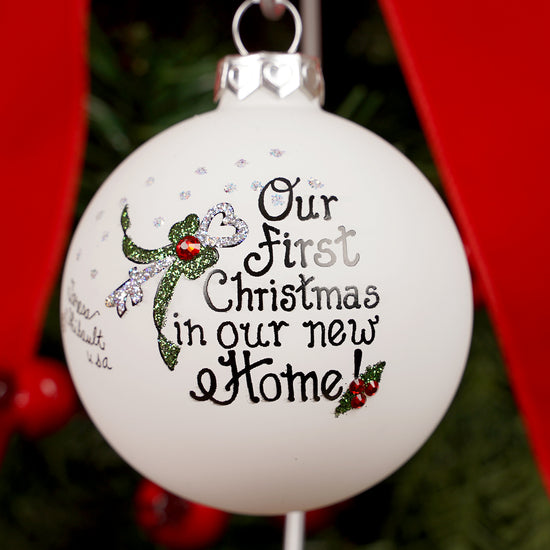 Christmas ornament with 'Our First Christmas in our new Home' text and a fairy design.