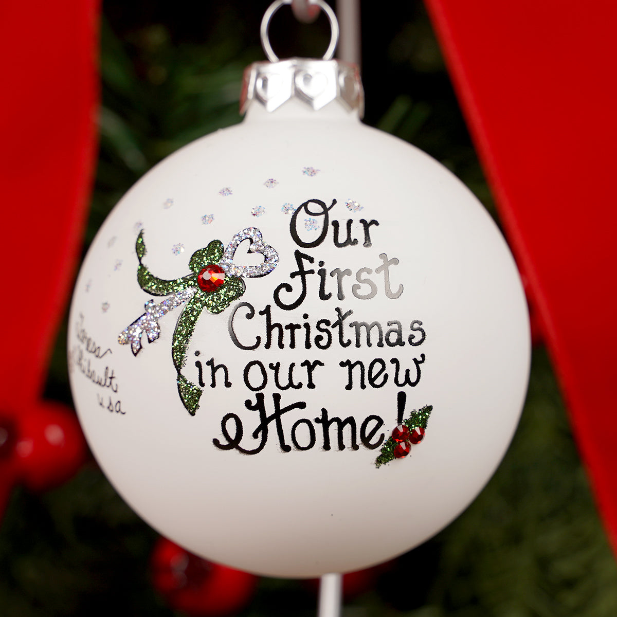 Christmas ornament with 'Our First Christmas in our new Home' text and a fairy design.