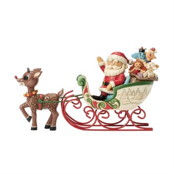 Rudolph Pulling Santa In Sled